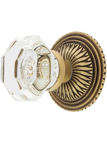 Sunburst Rosette Set With Octagon Crystal Knobs in Antique Brass.